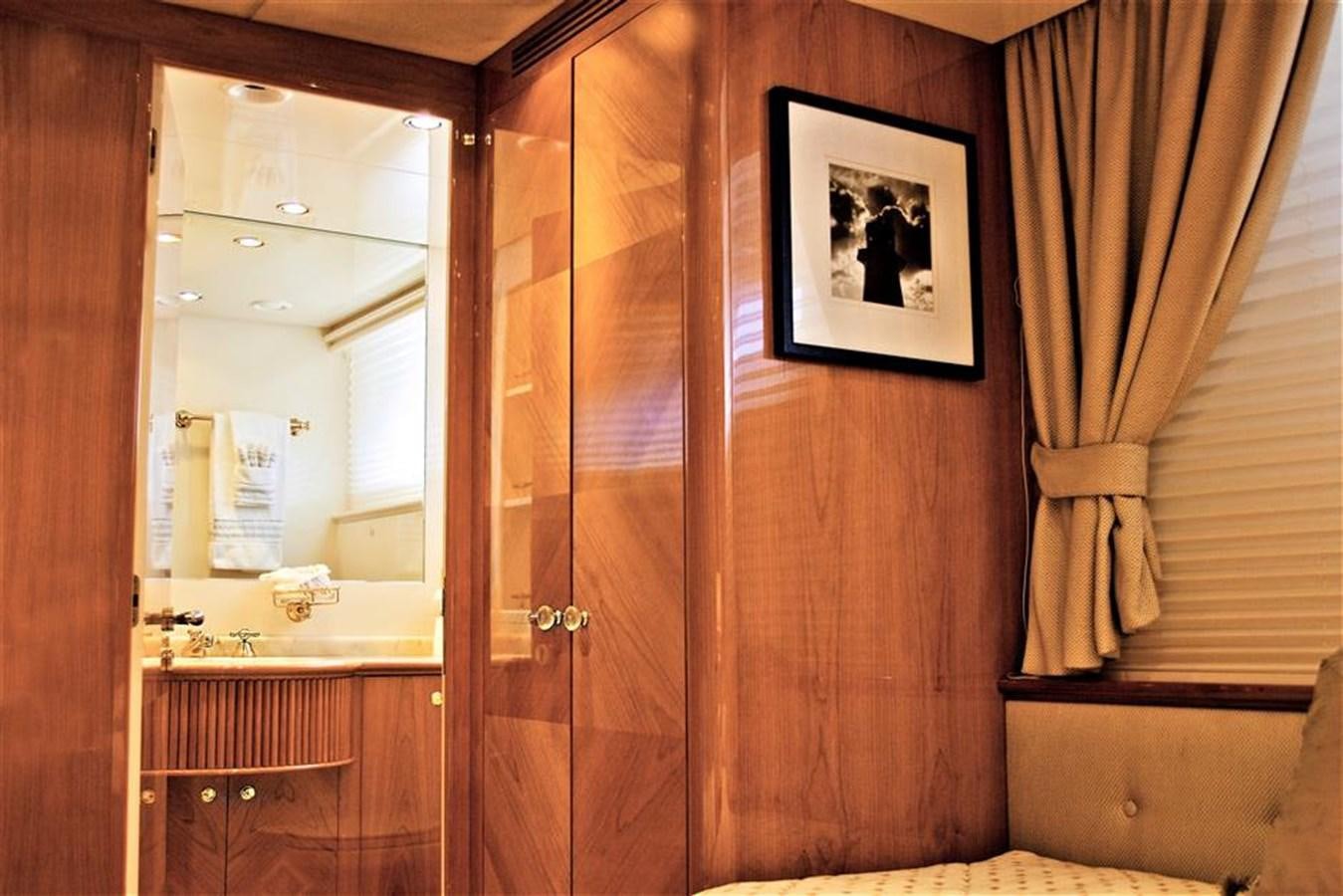a bathroom with a mirror and a door aboard CAROBELLE Yacht for Sale