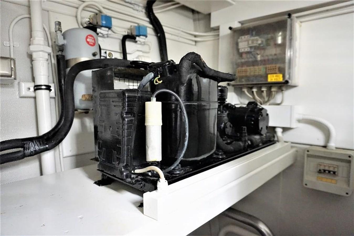 a machine with a large black object aboard CAROBELLE Yacht for Sale