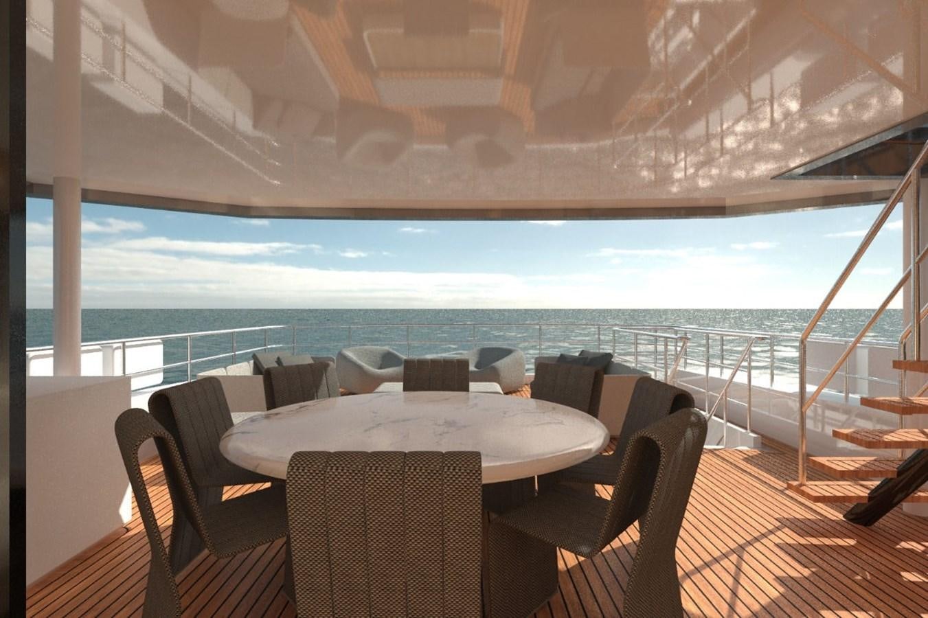 a table and chairs on a deck overlooking a body of water aboard AVENTURA 106 Yacht for Sale
