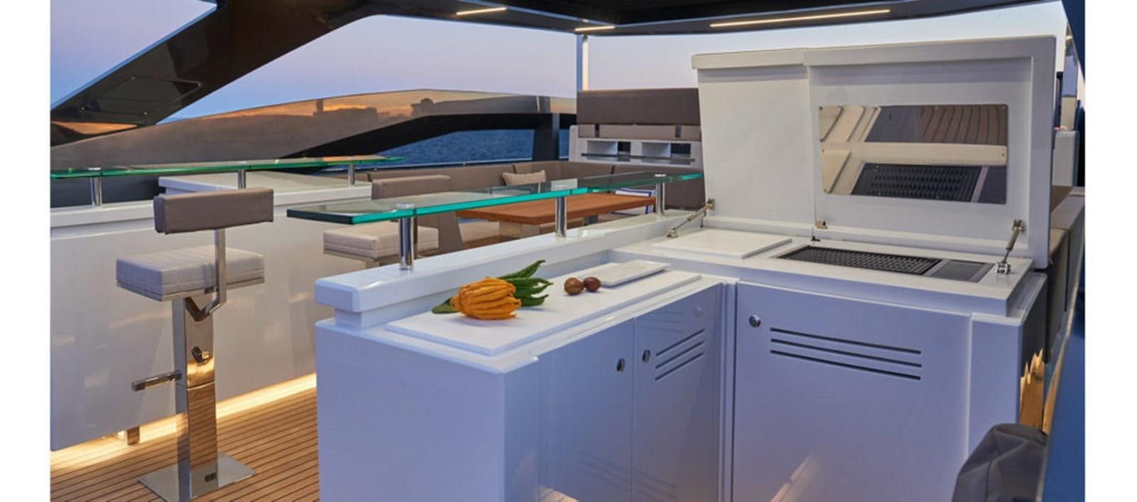 a kitchen with a large island aboard AST100CENROY Yacht for Sale