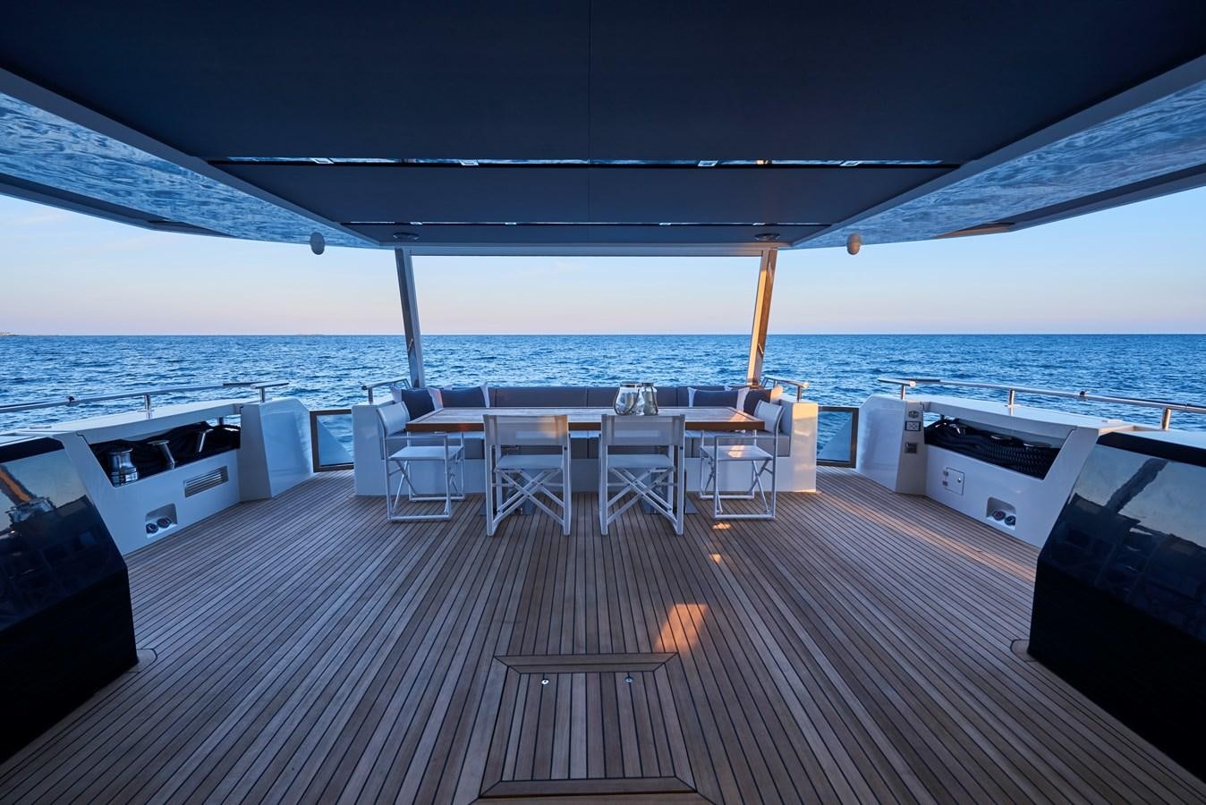 a deck with a view of the ocean and the deck aboard AST100CENROY Yacht for Sale