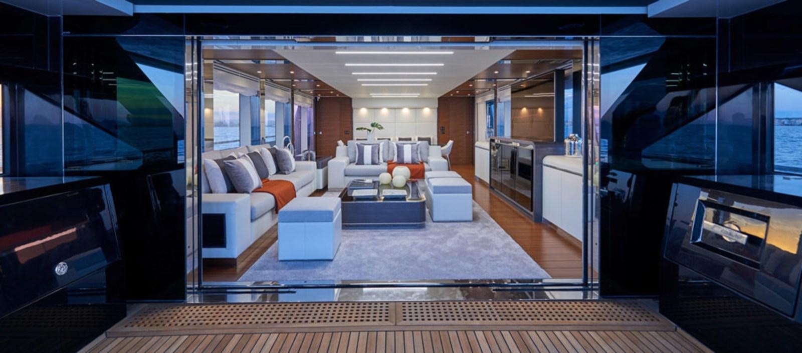 a living room with a large window aboard AST100CENROY Yacht for Sale