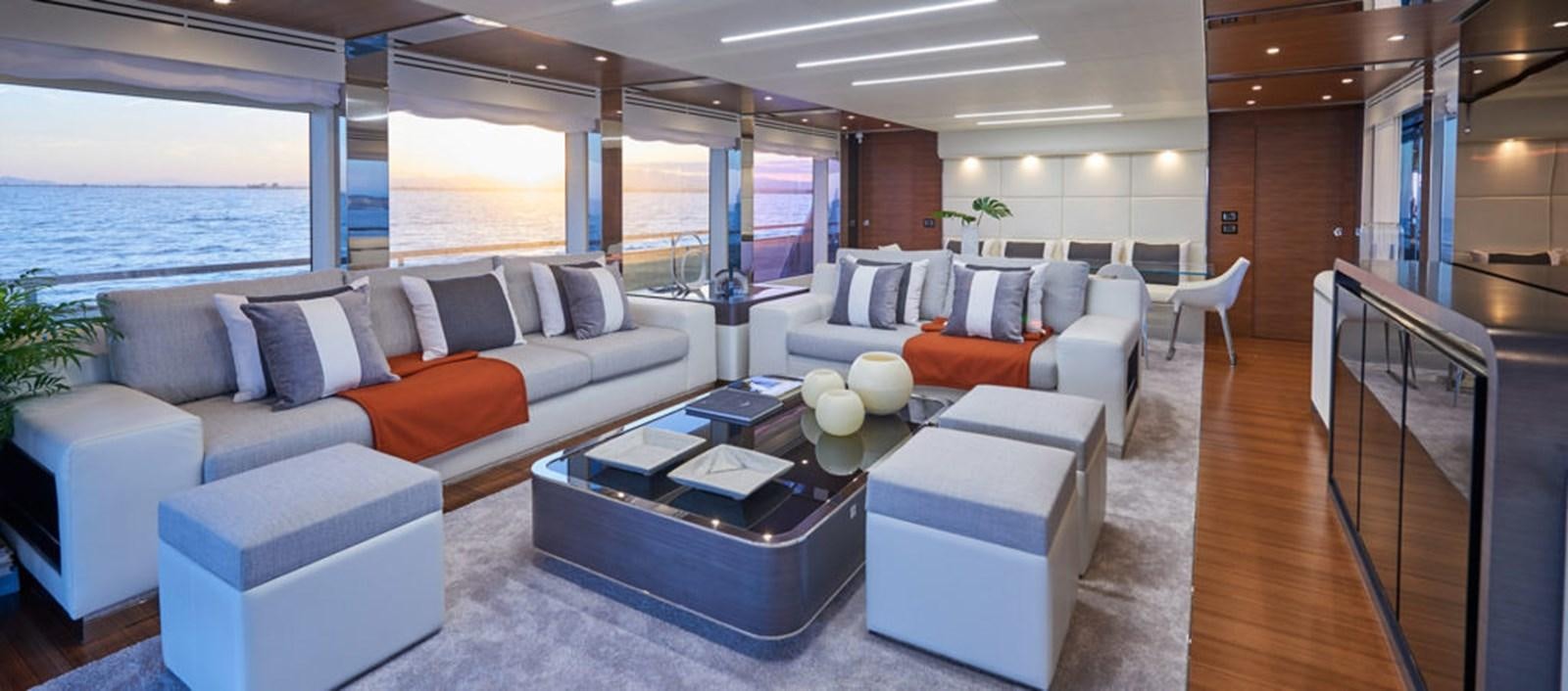a living room with a large glass window aboard AST100CENROY Yacht for Sale