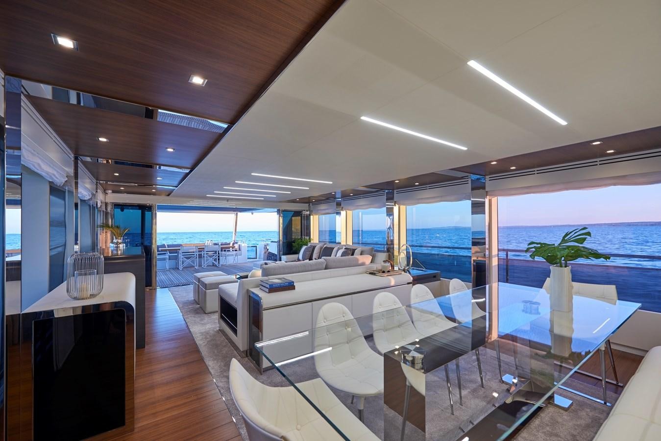 a room with a large window and a wood floor aboard AST100CENROY Yacht for Sale