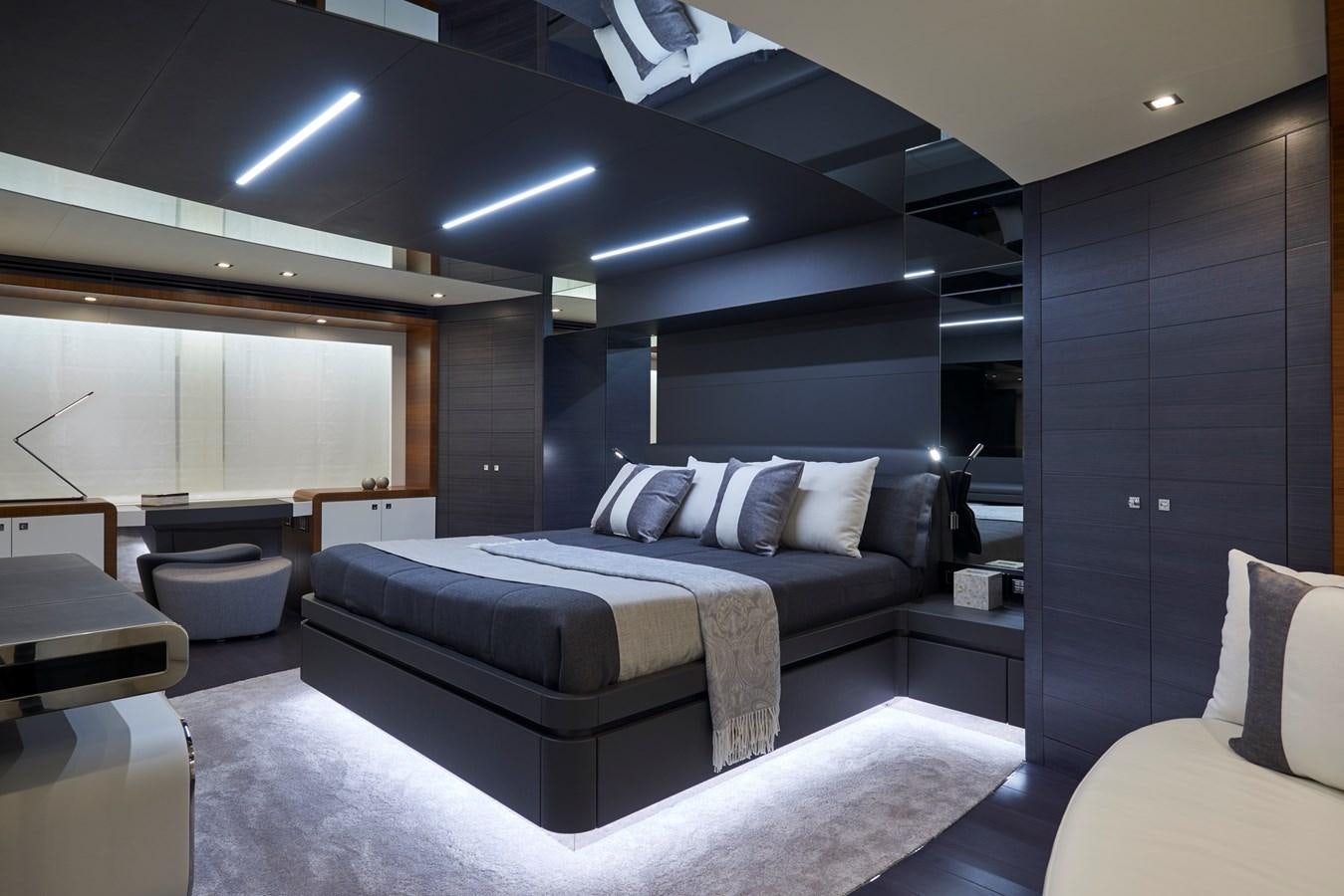 a room with a bed and a couch aboard AST100CENROY Yacht for Sale