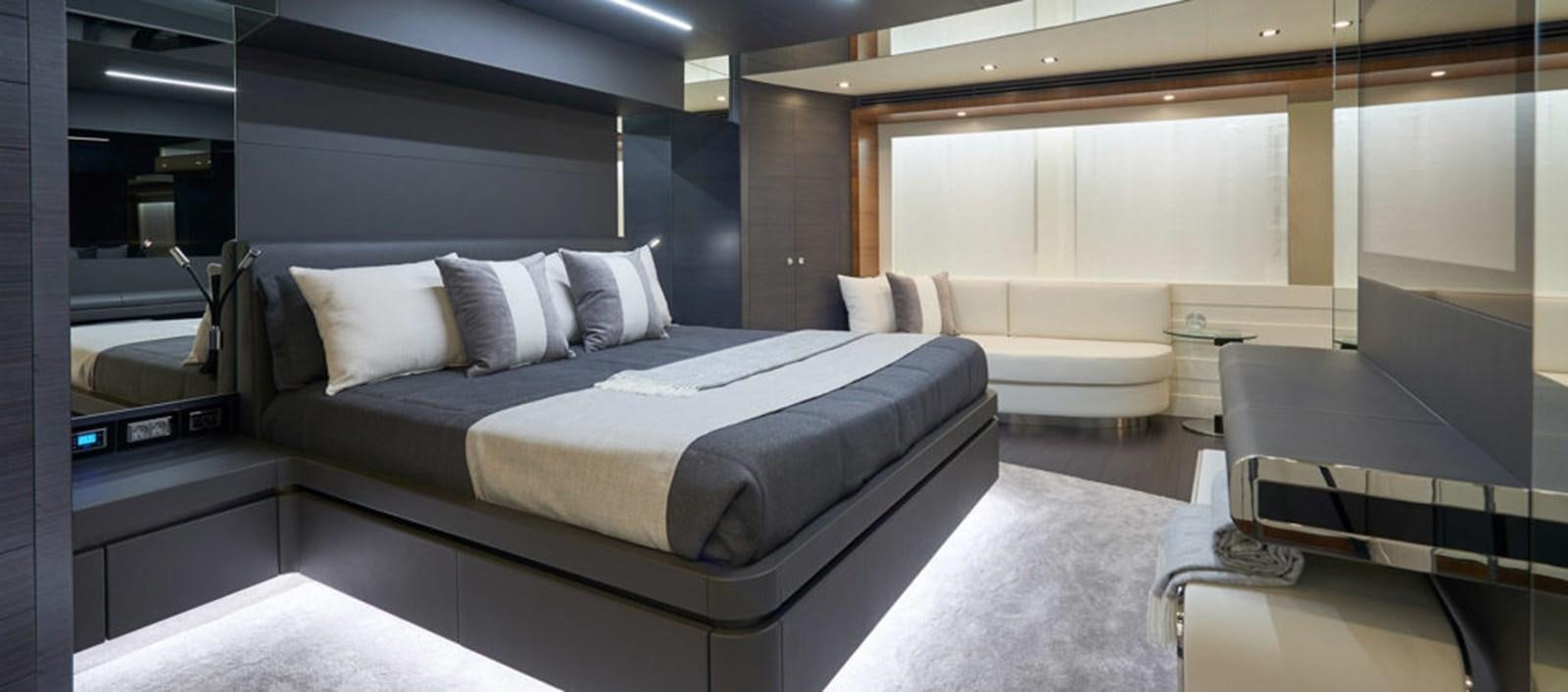 a room with a bed and a couch aboard AST100CENROY Yacht for Sale