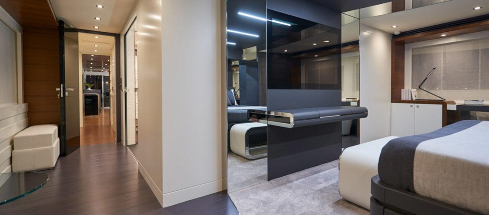 a room with a bed and a desk aboard AST100CENROY Yacht for Sale