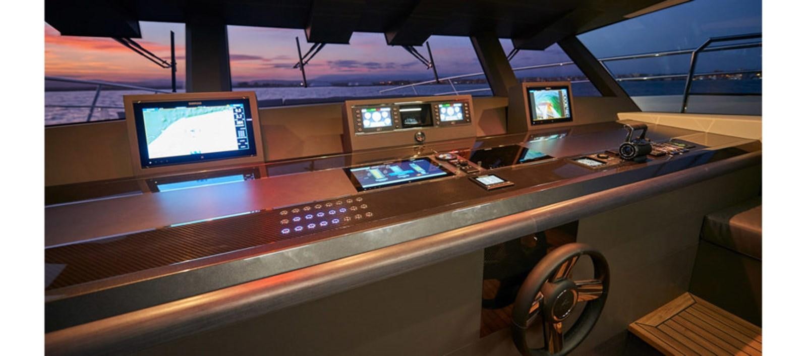 a desk with computers on it aboard AST100CENROY Yacht for Sale