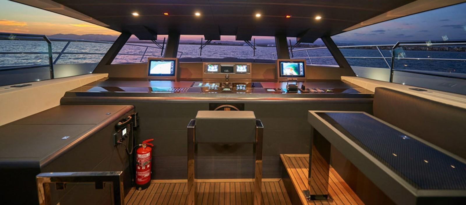 a room with a desk and chairs aboard AST100CENROY Yacht for Sale