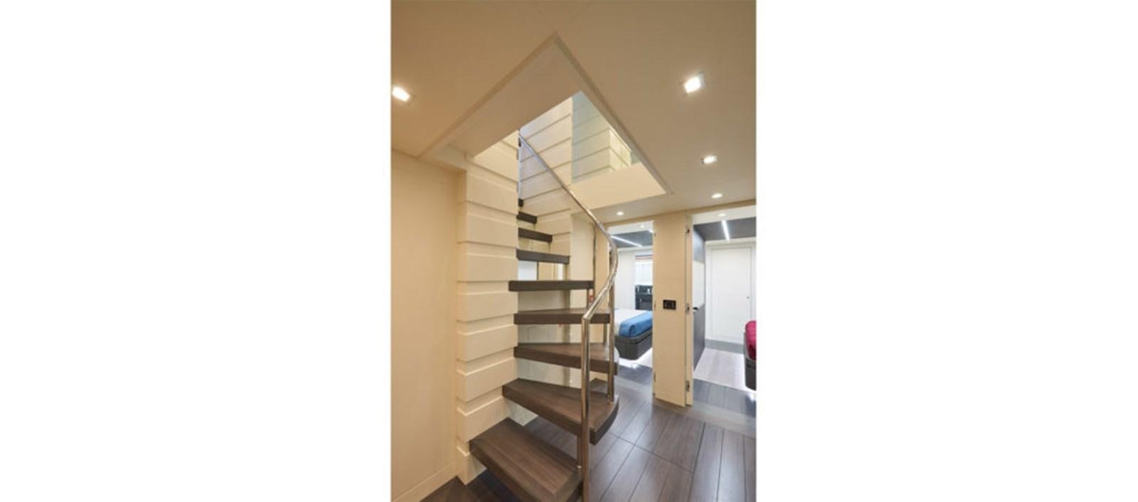 a long hallway with a staircase aboard AST100CENROY Yacht for Sale