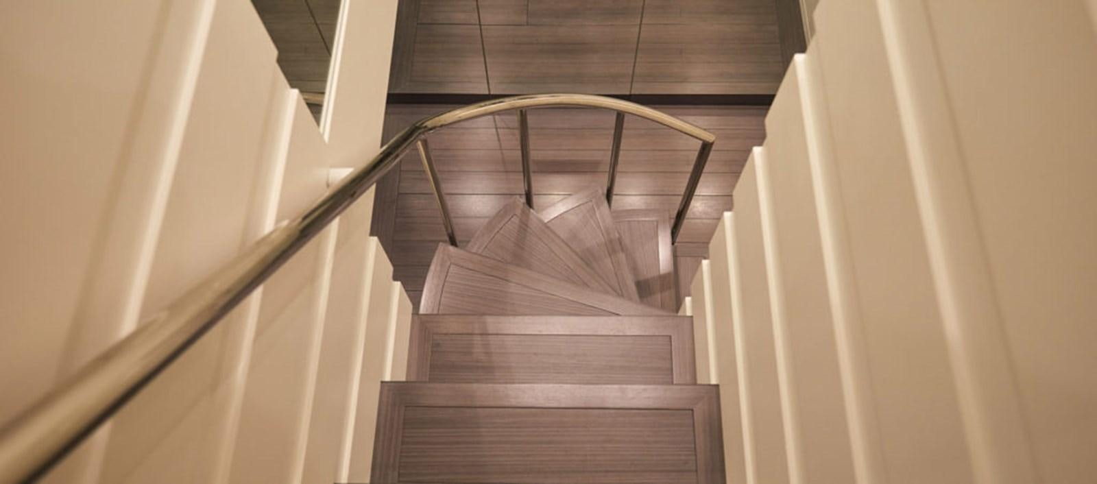 a staircase with a railing aboard AST100CENROY Yacht for Sale