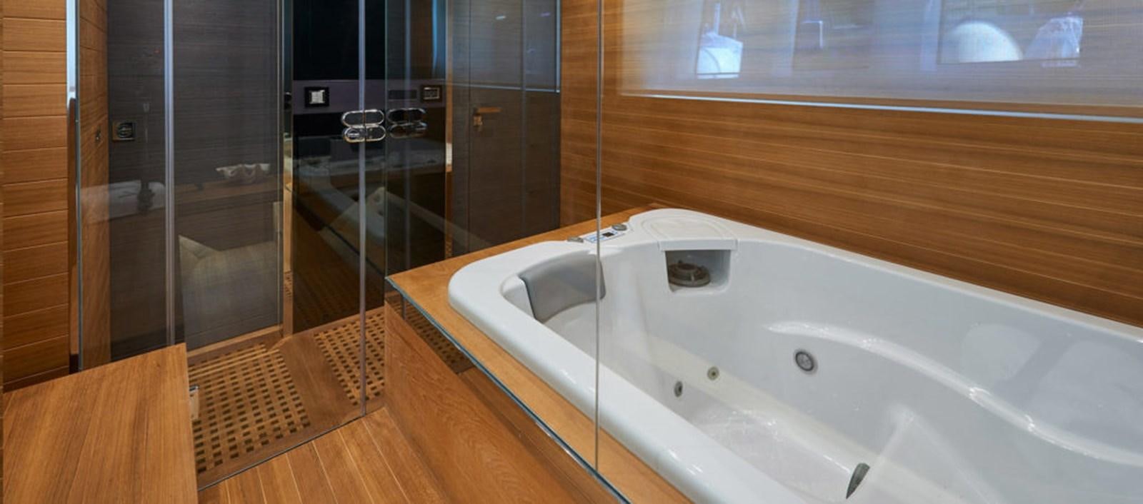 a white bathtub with a sink aboard AST100CENROY Yacht for Sale