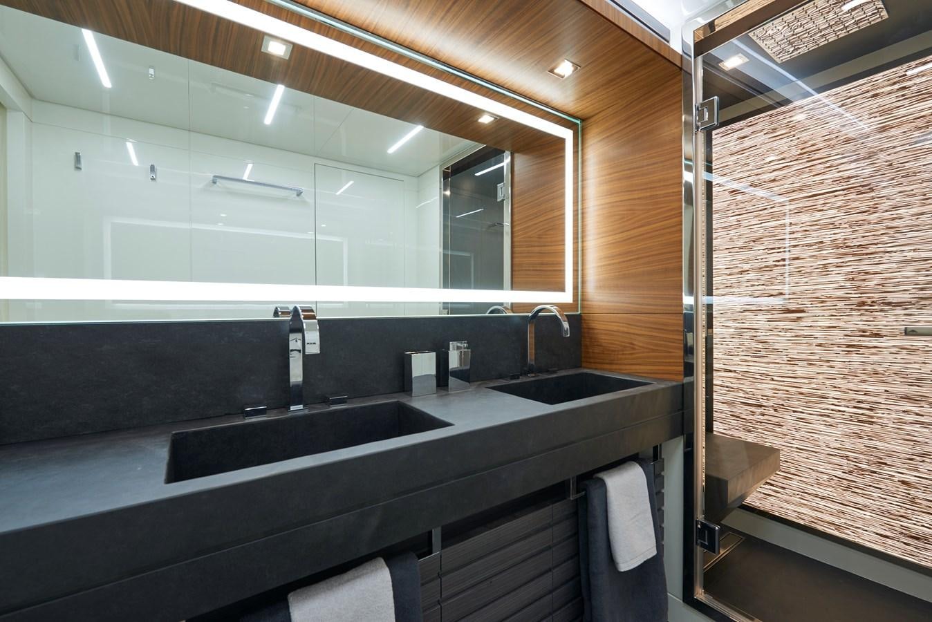 a bathroom with a sink and a mirror aboard AST100CENROY Yacht for Sale