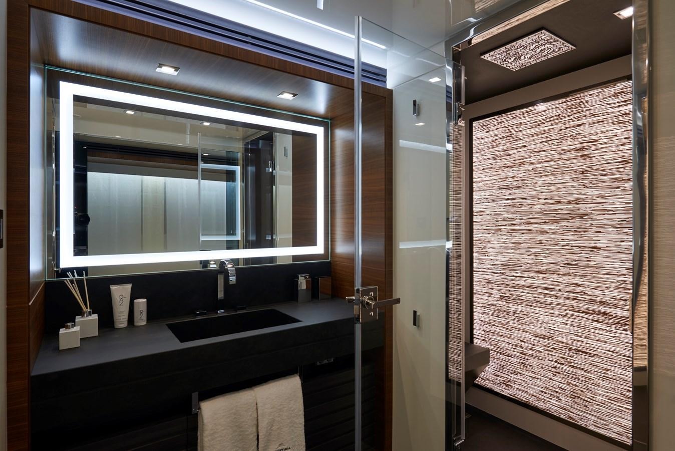 a bathroom with a sink and a mirror aboard AST100CENROY Yacht for Sale