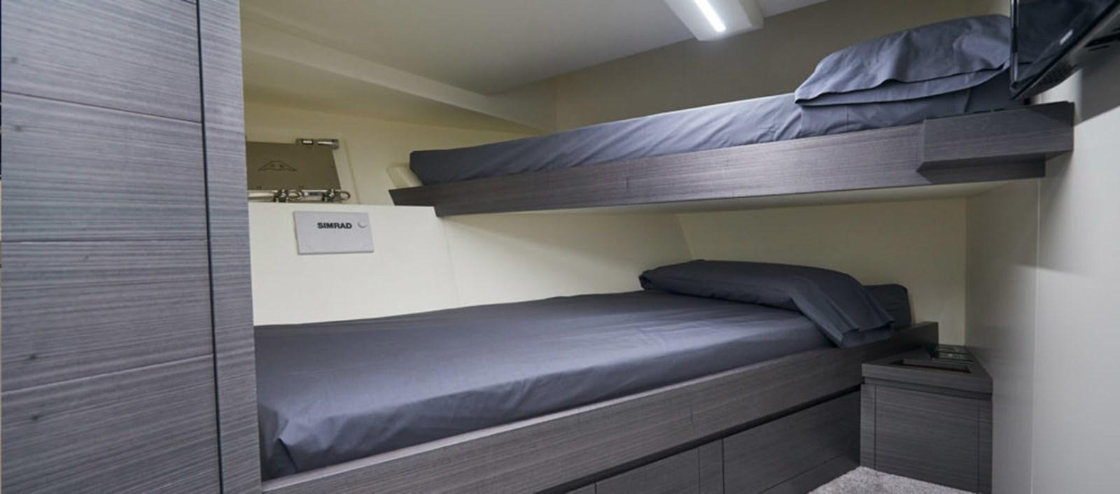 a bed with a white sheet aboard AST100CENROY Yacht for Sale