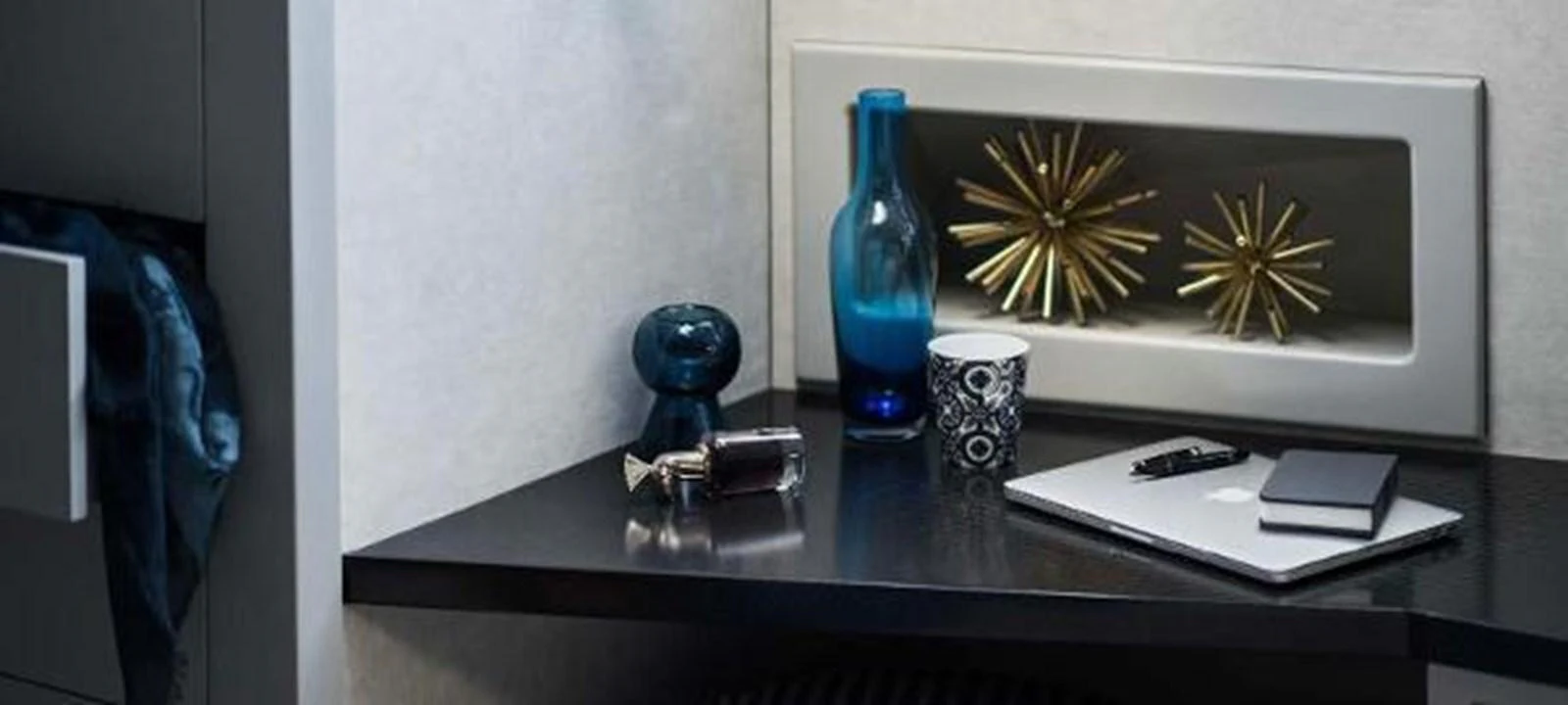 a desk with a phone and a lamp on it aboard JAMADHAR Yacht for Sale