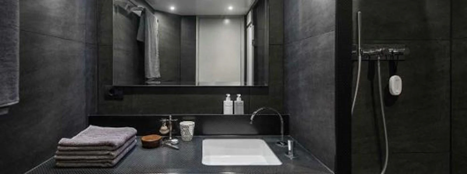 a bathroom with a large mirror aboard JAMADHAR Yacht for Sale