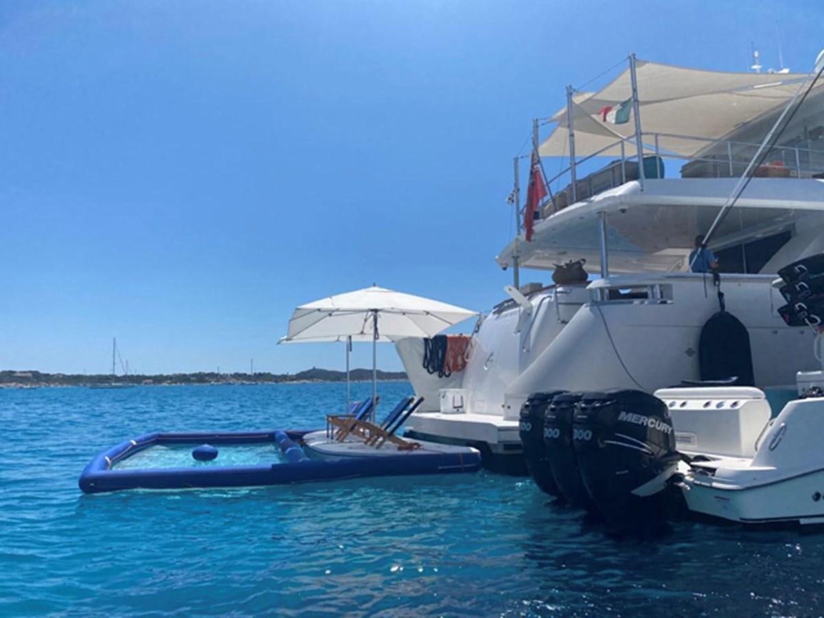 a boat is parked in the water aboard MAGALITA V Yacht for Sale