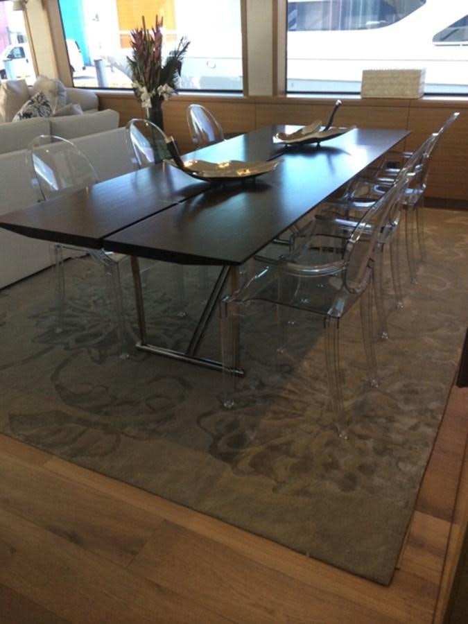 a table with a plate on it aboard MAGALITA V Yacht for Sale