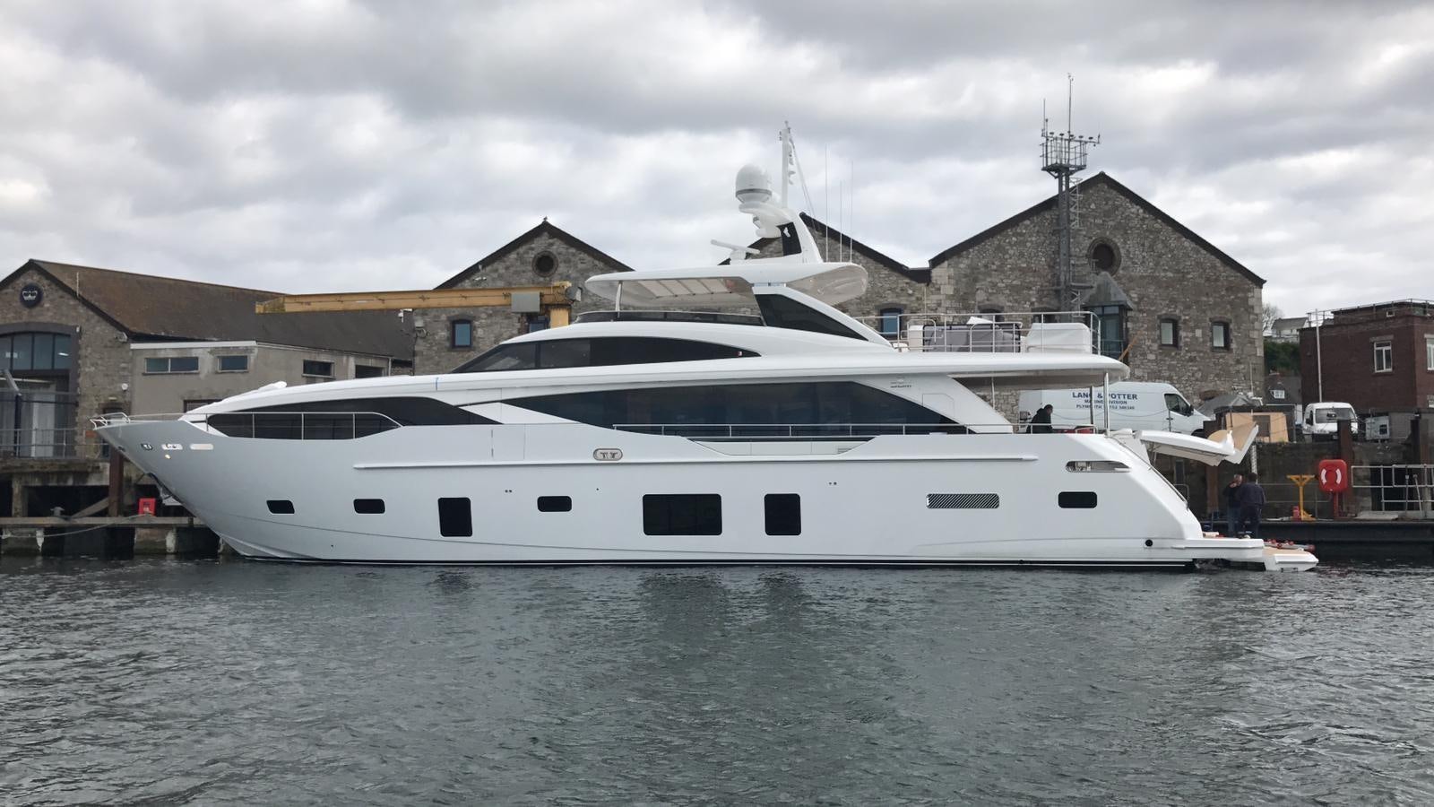 a white yacht in a harbor aboard THE SPIRIT OF ELIJAH Yacht for Sale