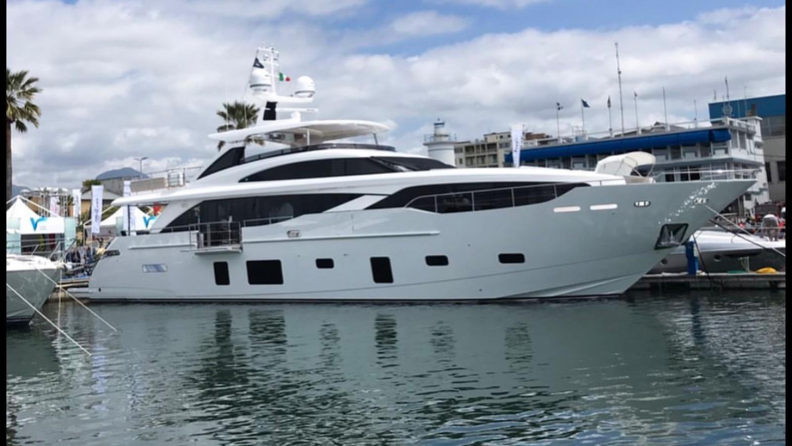 a large white yacht in a harbor aboard THE SPIRIT OF ELIJAH Yacht for Sale