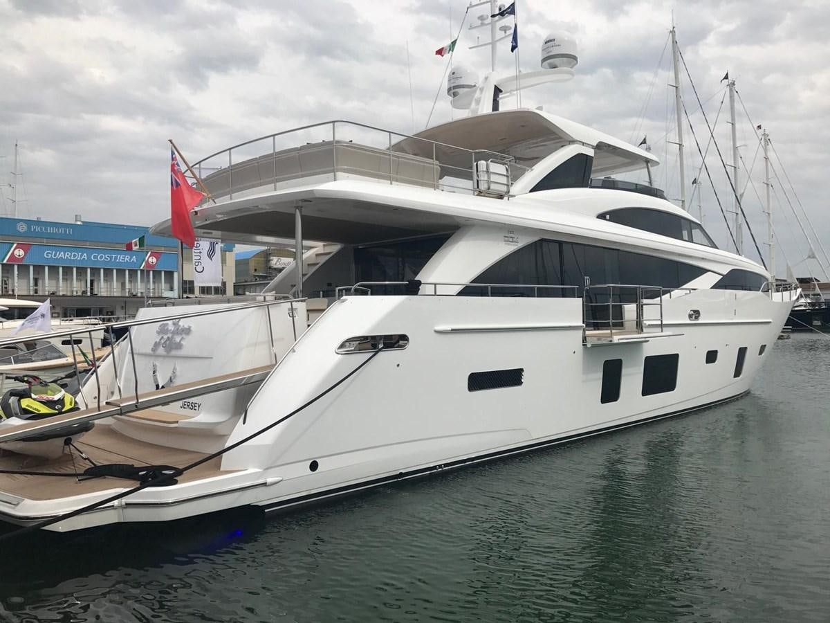 a large white boat in a harbor aboard THE SPIRIT OF ELIJAH Yacht for Sale