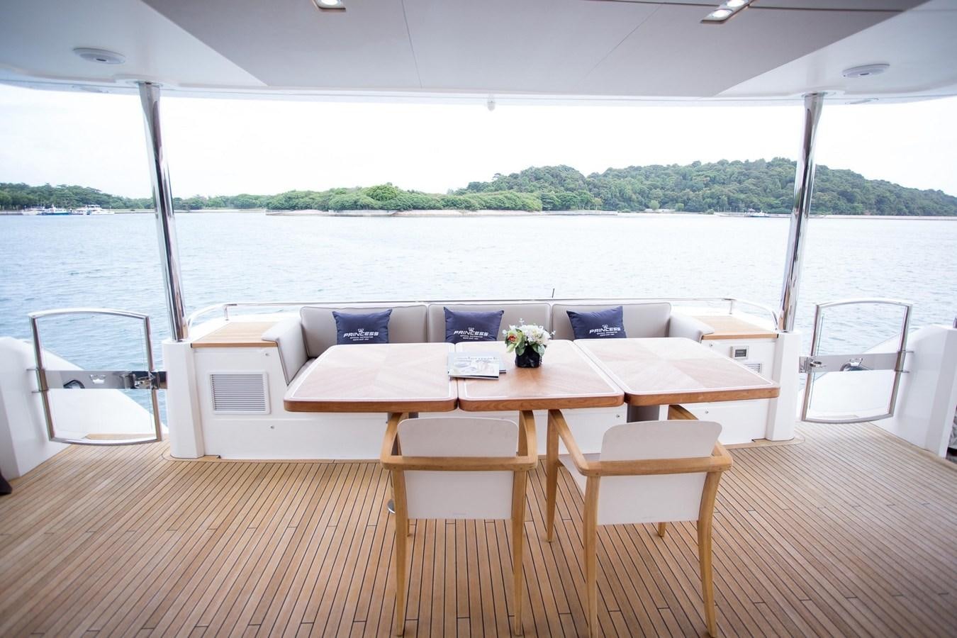 a table and chairs on a deck aboard THE SPIRIT OF ELIJAH Yacht for Sale