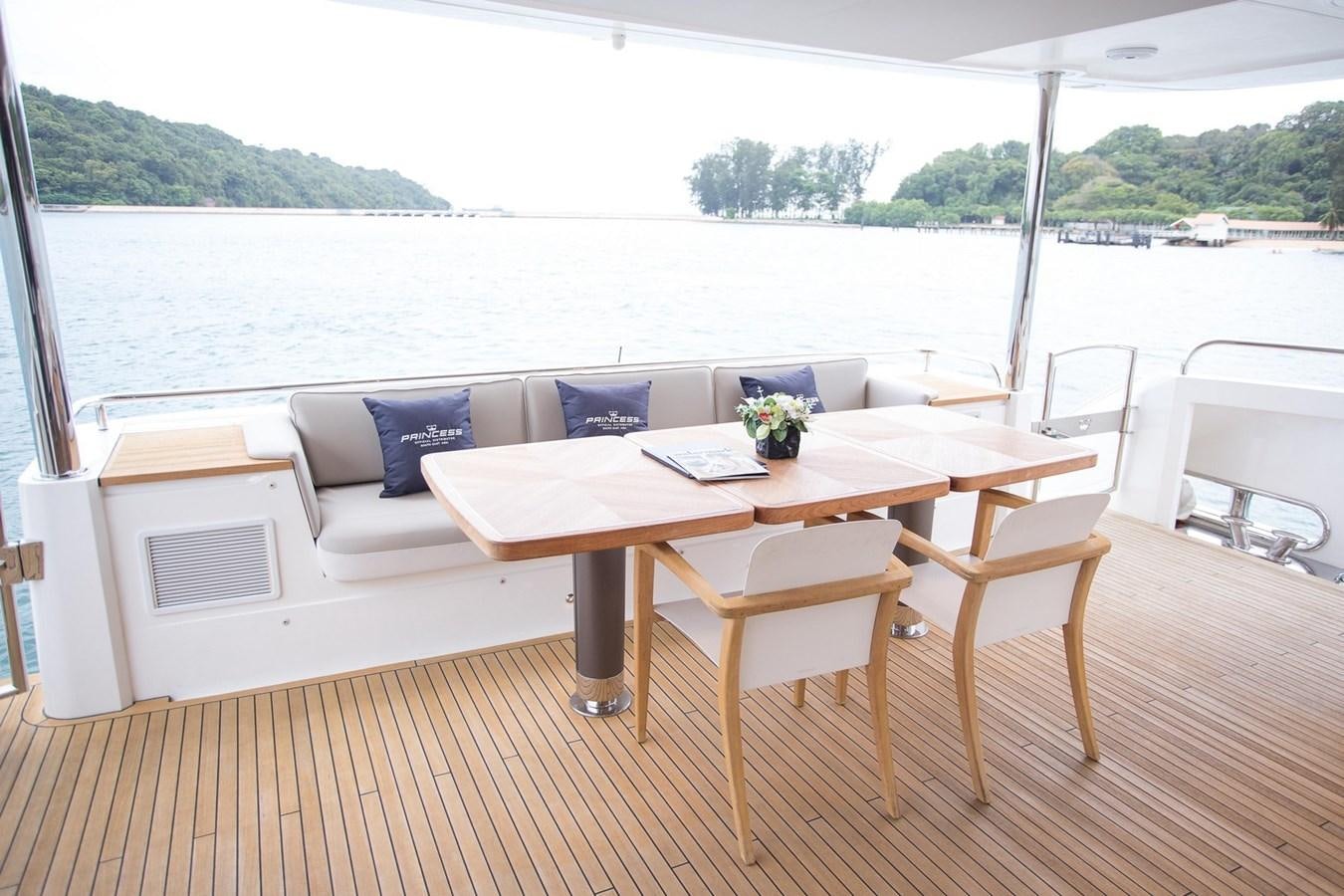 a table and chairs on a deck aboard THE SPIRIT OF ELIJAH Yacht for Sale