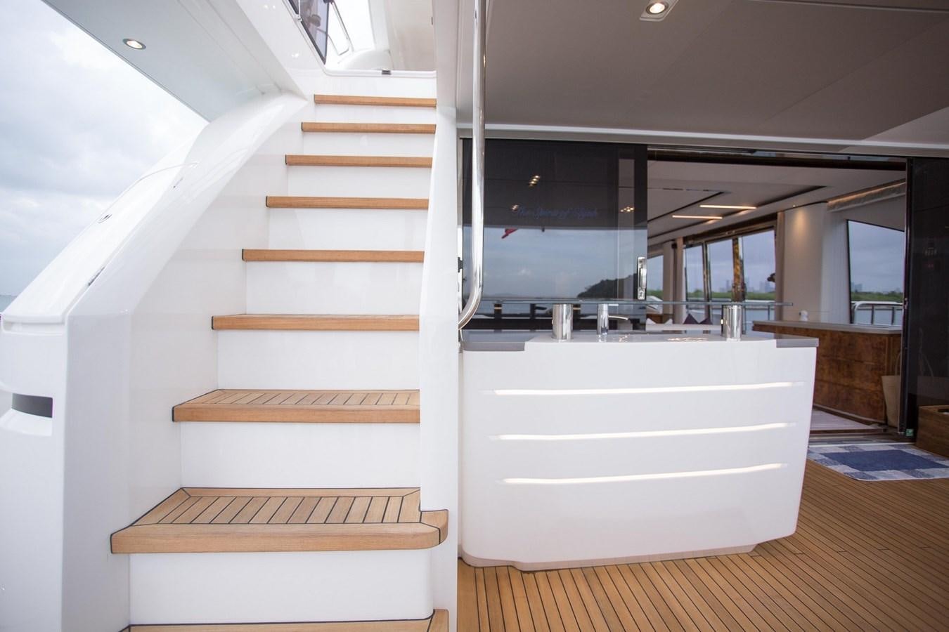 a white staircase in a building aboard THE SPIRIT OF ELIJAH Yacht for Sale