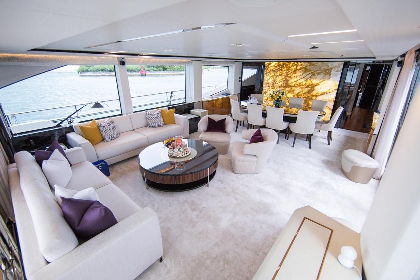 a living room with a large window aboard THE SPIRIT OF ELIJAH Yacht for Sale