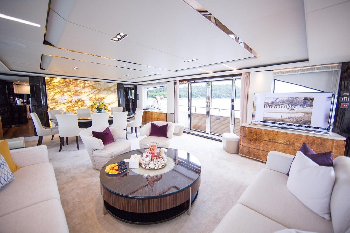 a living room with a large screen aboard THE SPIRIT OF ELIJAH Yacht for Sale