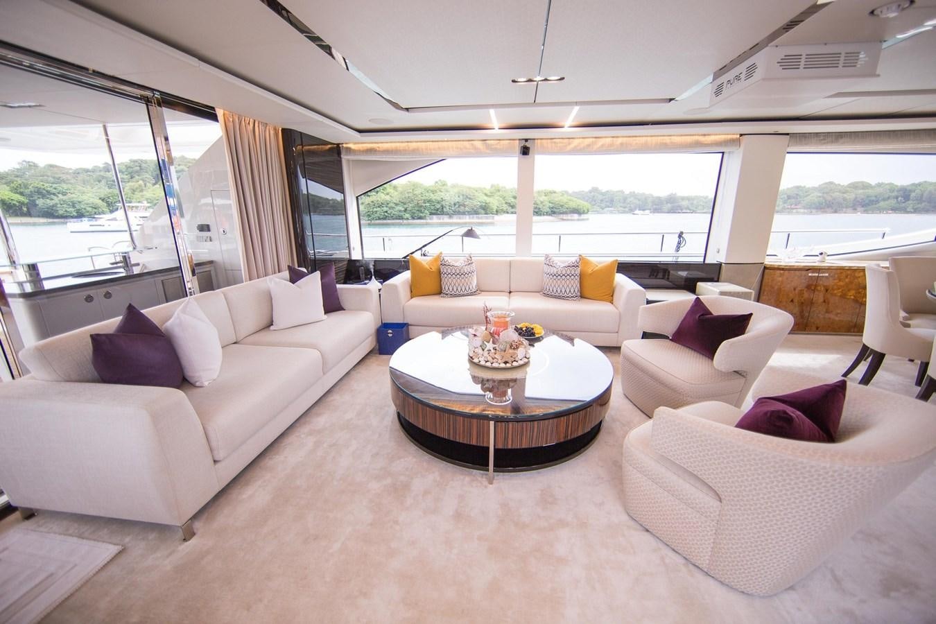 a living room with a large window aboard THE SPIRIT OF ELIJAH Yacht for Sale