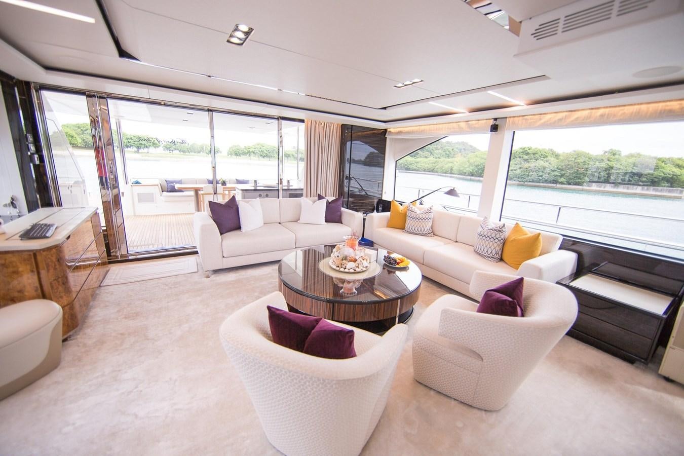 a living room with a large window aboard THE SPIRIT OF ELIJAH Yacht for Sale