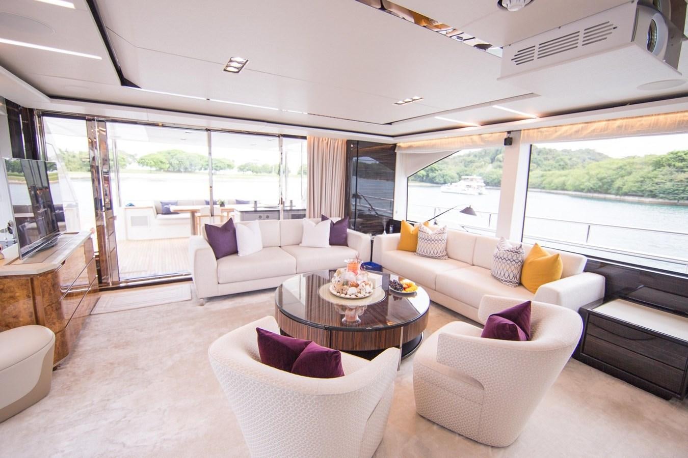 a living room with a large window aboard THE SPIRIT OF ELIJAH Yacht for Sale