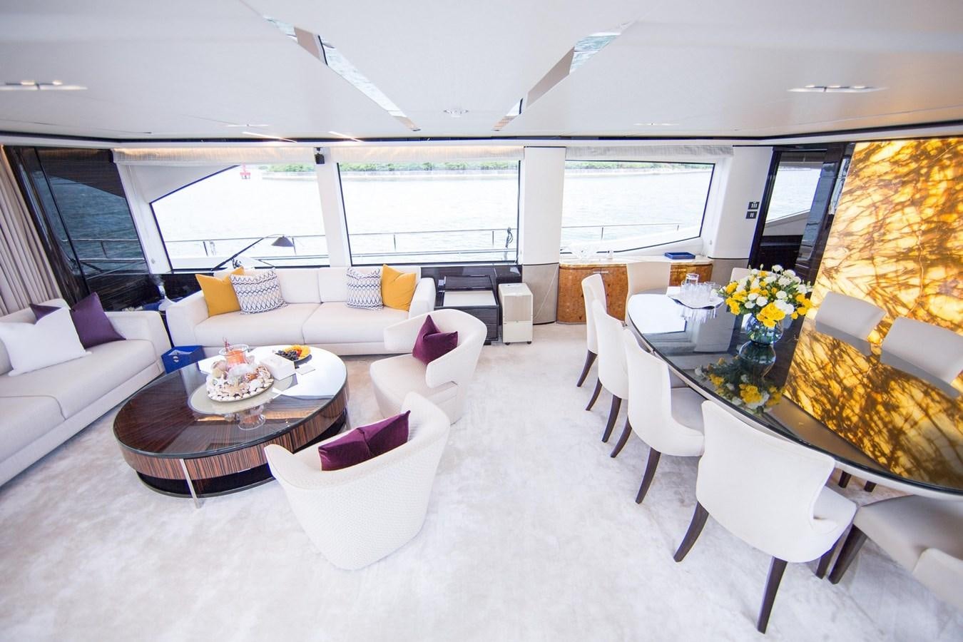 a living room with a large window aboard THE SPIRIT OF ELIJAH Yacht for Sale