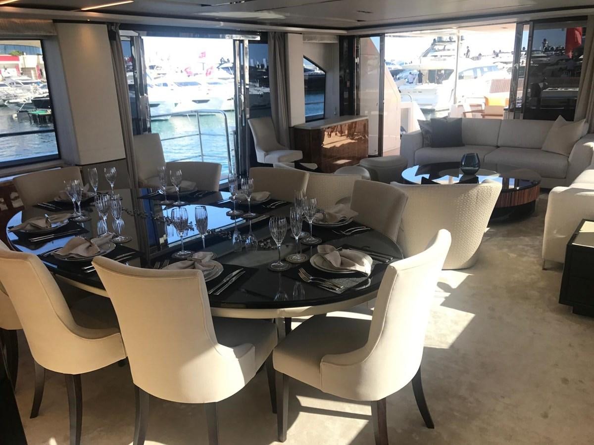 a room with a table chairs and a television aboard THE SPIRIT OF ELIJAH Yacht for Sale