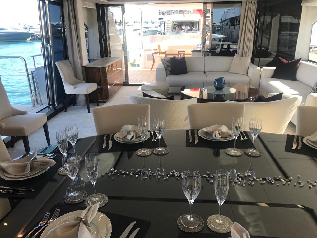 a table with wine glasses and plates aboard THE SPIRIT OF ELIJAH Yacht for Sale