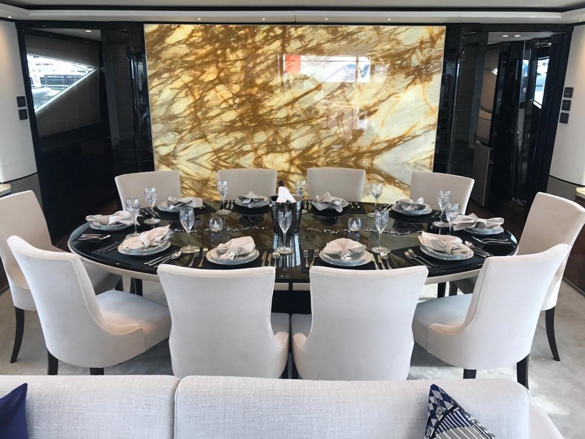 a table set with white chairs aboard THE SPIRIT OF ELIJAH Yacht for Sale