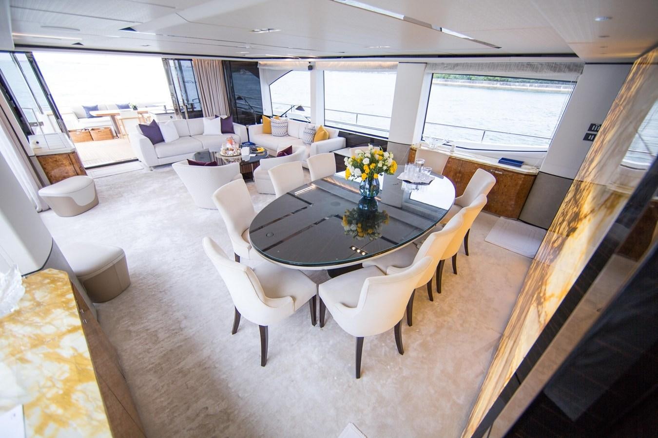 a room with a table chairs and a window aboard THE SPIRIT OF ELIJAH Yacht for Sale