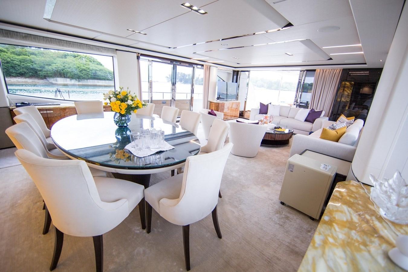 a room with a table chairs and a couch aboard THE SPIRIT OF ELIJAH Yacht for Sale