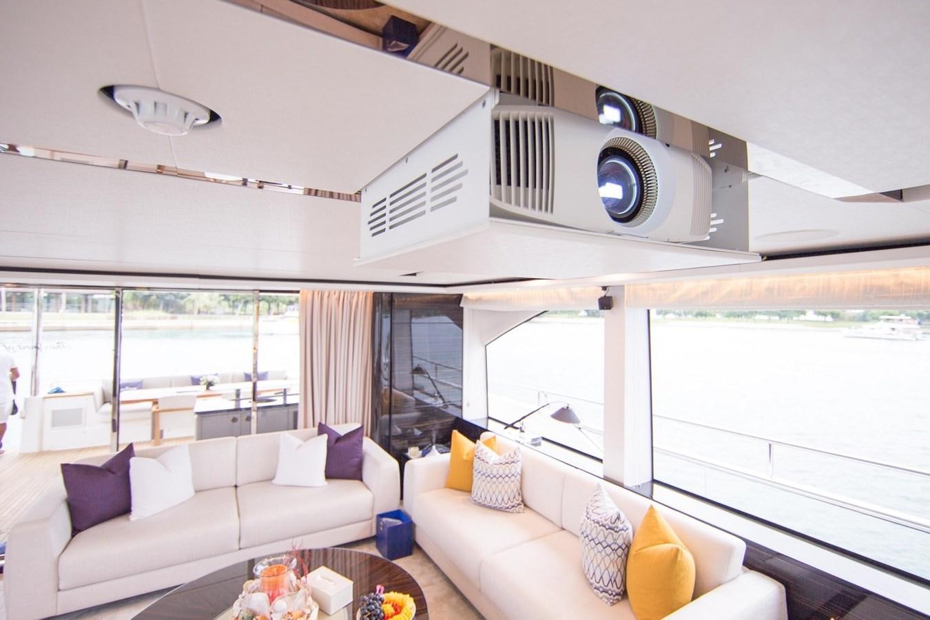 a living room with a large window aboard THE SPIRIT OF ELIJAH Yacht for Sale