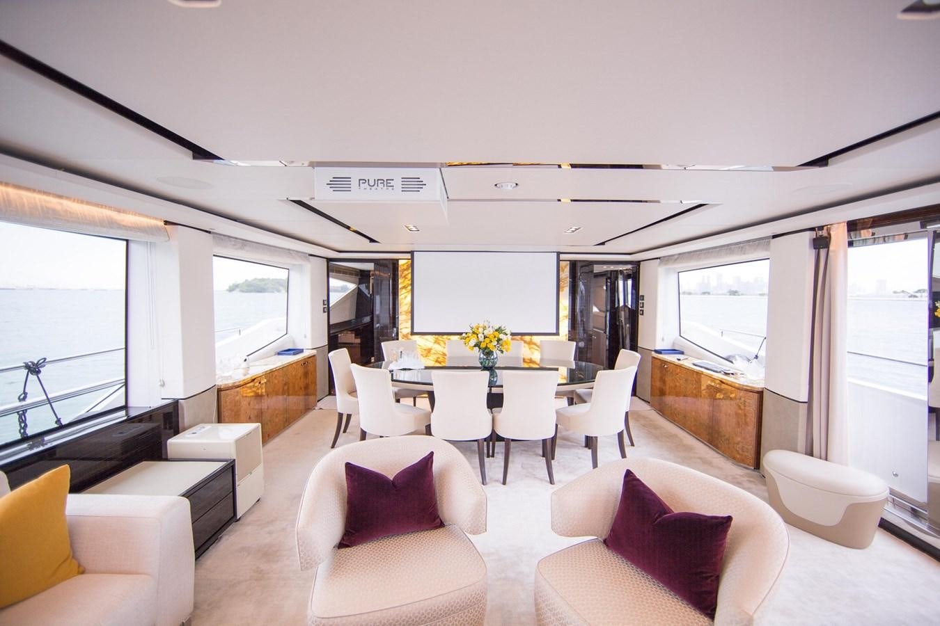 a room with a table and chairs aboard THE SPIRIT OF ELIJAH Yacht for Sale
