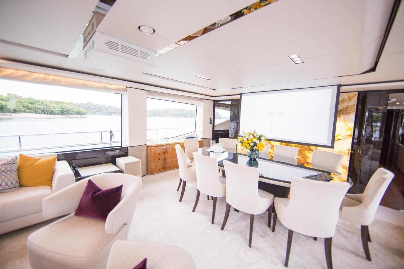 a room with a table chairs and a couch aboard THE SPIRIT OF ELIJAH Yacht for Sale