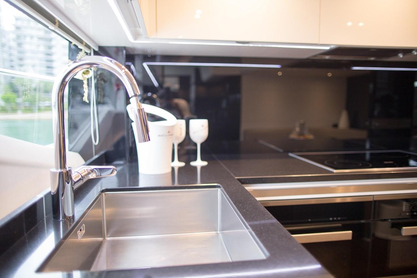 a large kitchen with a large glass window aboard THE SPIRIT OF ELIJAH Yacht for Sale