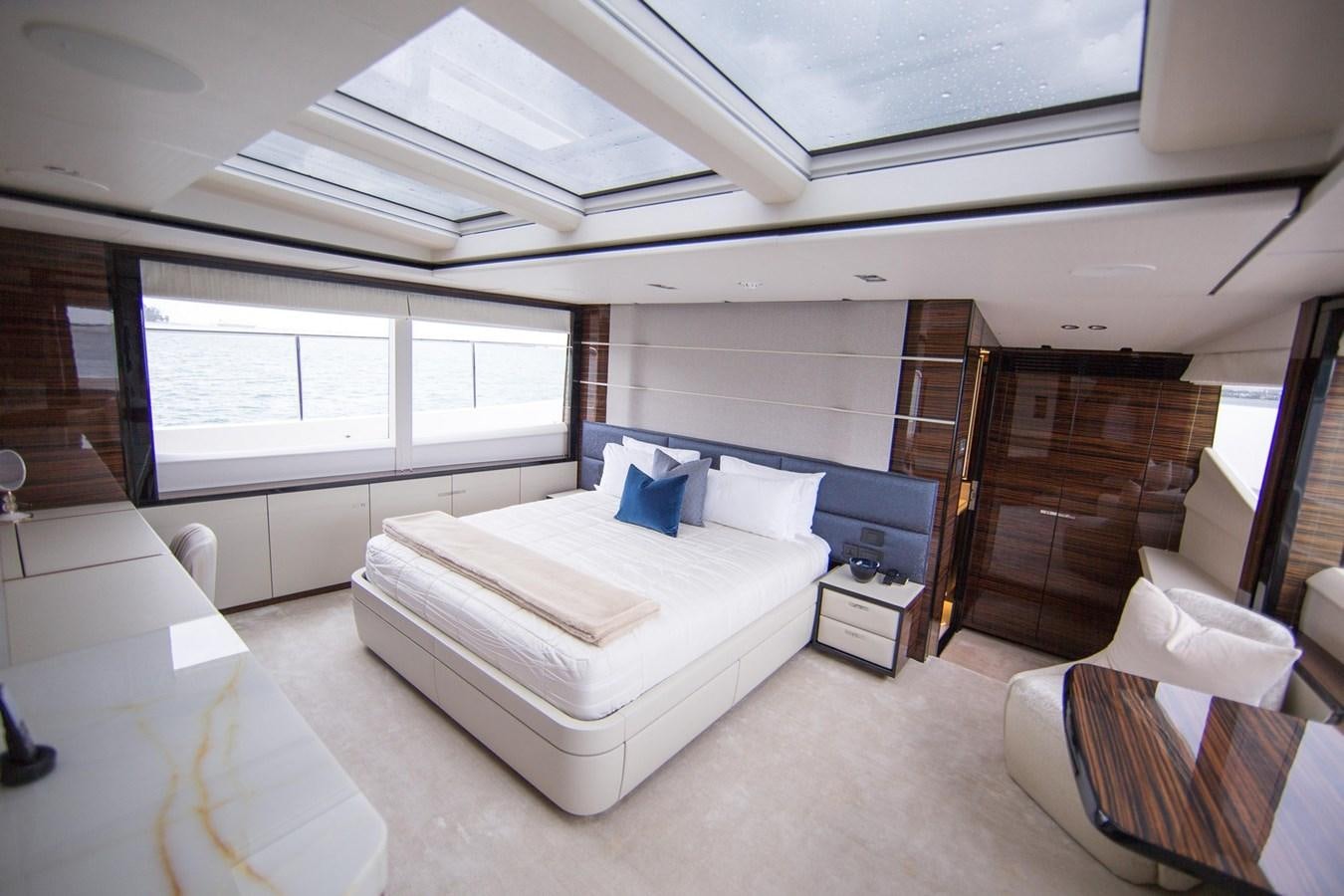 a room with a bed and a desk aboard THE SPIRIT OF ELIJAH Yacht for Sale