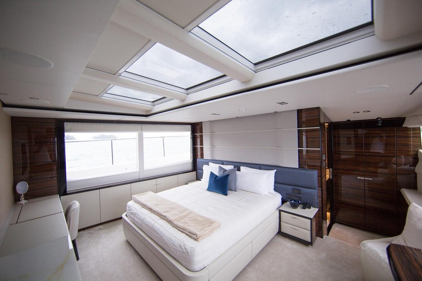 a room with a bed and a desk aboard THE SPIRIT OF ELIJAH Yacht for Sale
