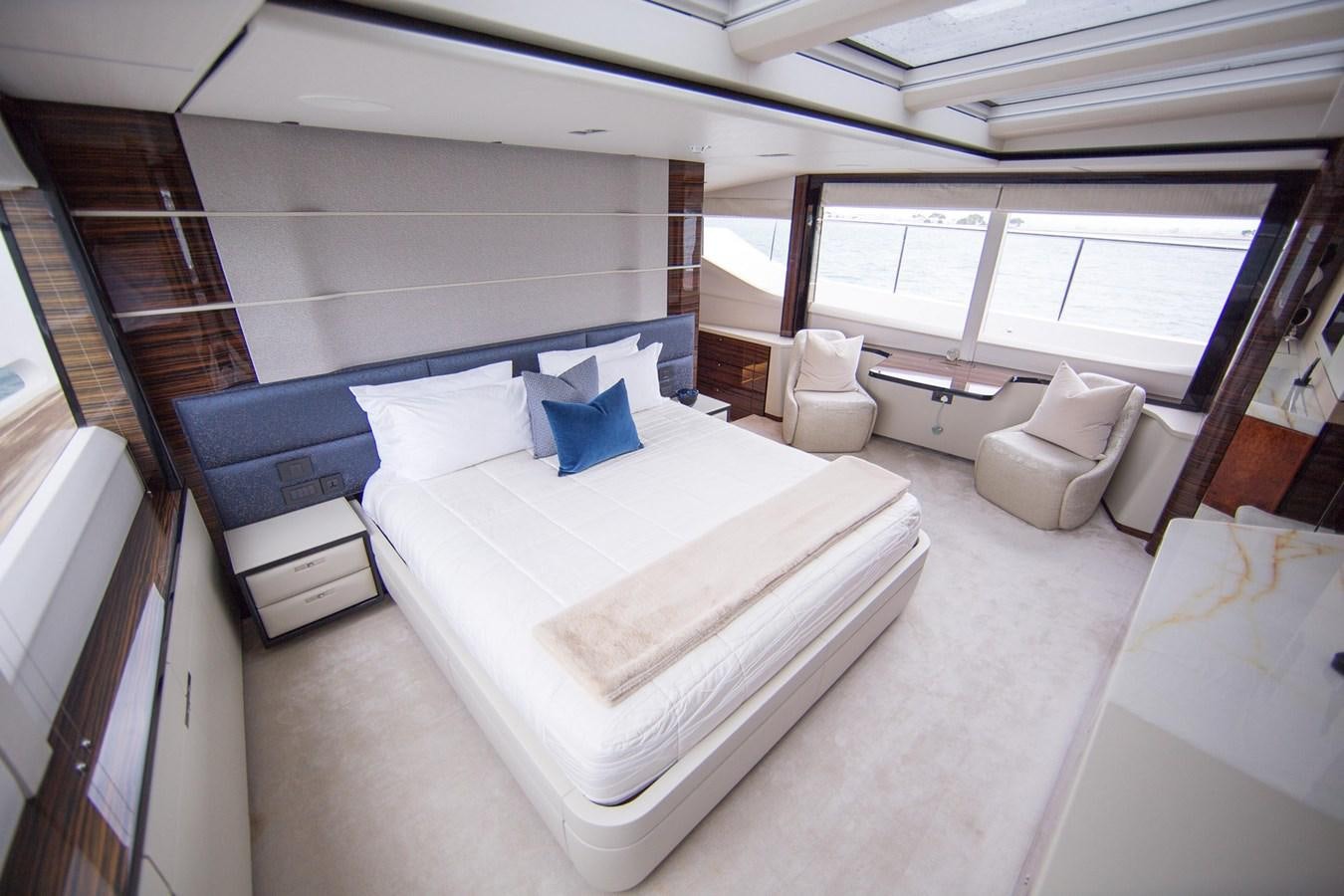 a room with a bed and a window aboard THE SPIRIT OF ELIJAH Yacht for Sale