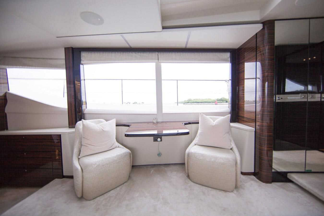 a room with a couple of couches and a table aboard THE SPIRIT OF ELIJAH Yacht for Sale