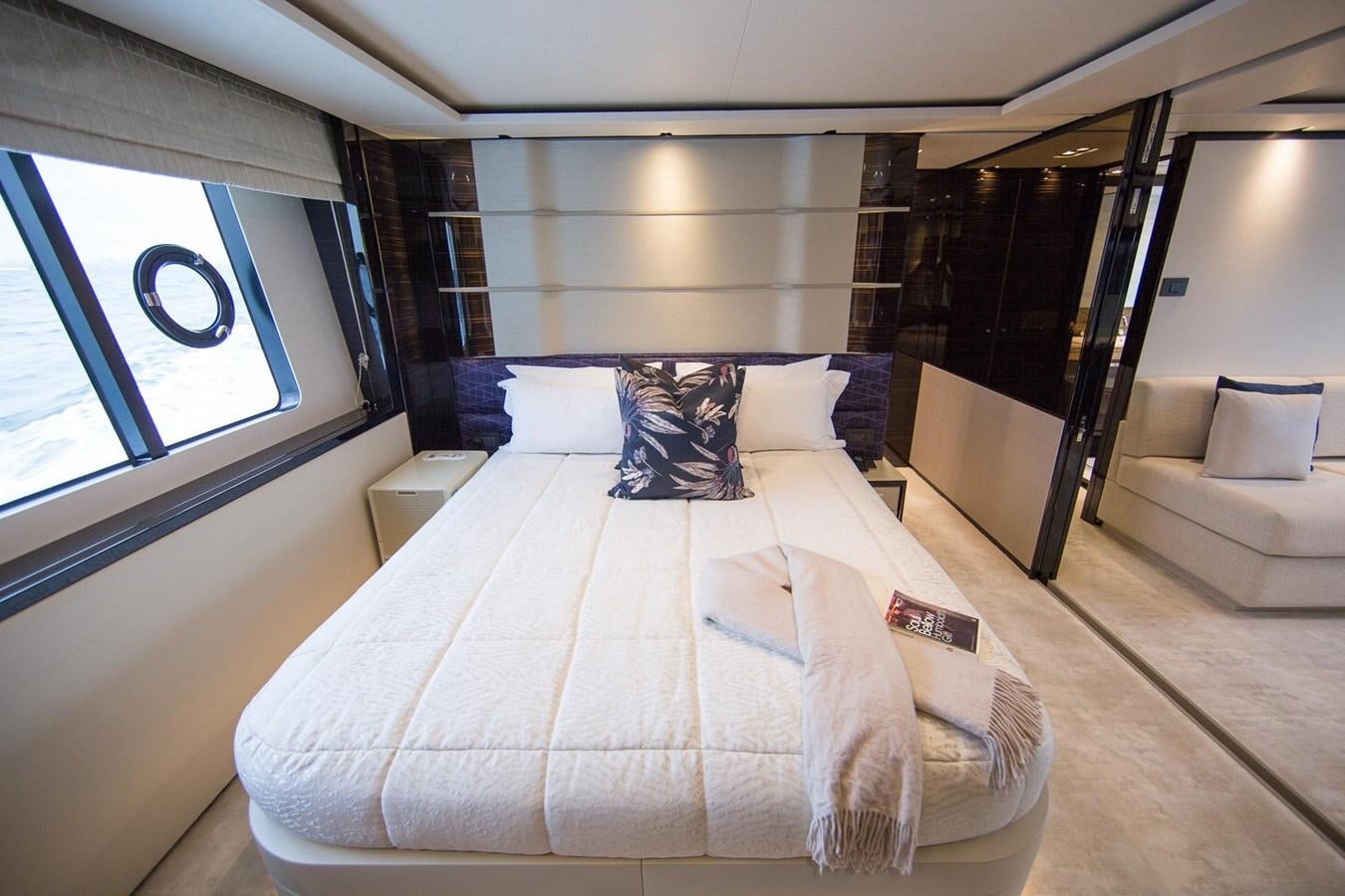 a room with a bed and a window aboard THE SPIRIT OF ELIJAH Yacht for Sale