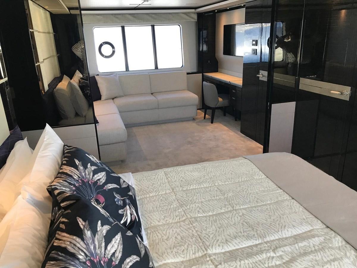 a bedroom with a bed and a tv aboard THE SPIRIT OF ELIJAH Yacht for Sale
